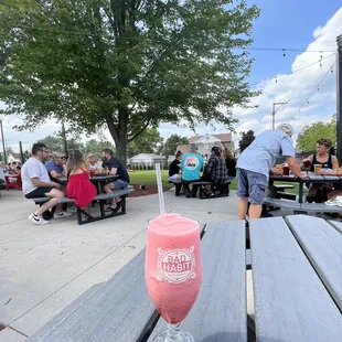 a drink on a picnic table