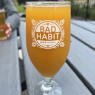 a glass of beer on a table