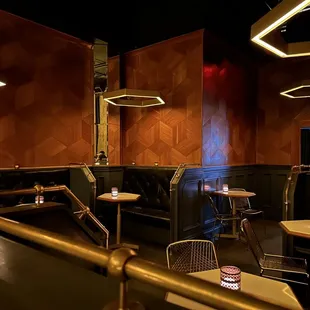 tables and chairs in a dimly lit room