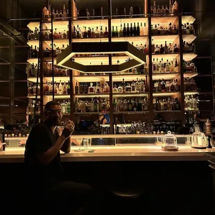 a man sitting at a bar
