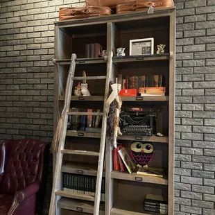 a ladder leaning against a bookshelf