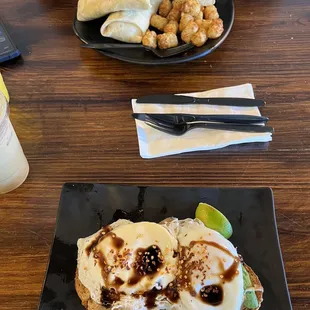 Avocado toast and breakfast burrito with tater tots