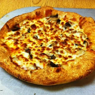 a pizza with cheese and olives