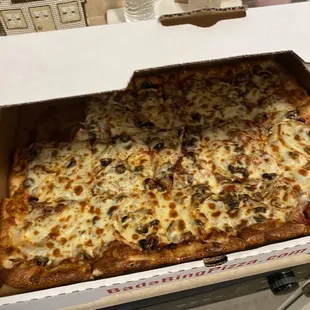 1/2 sheet Piazza Deluxe, no green peppers added black olives. 04/25/23