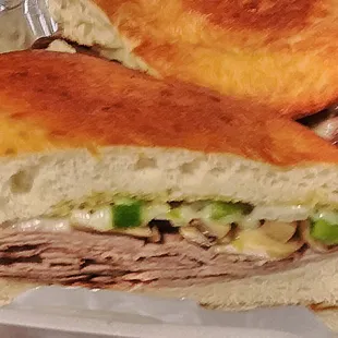 The Painesville steak sub with roast beef, mushroom, green pepper, onion, Swiss cheese and garlic sauce.