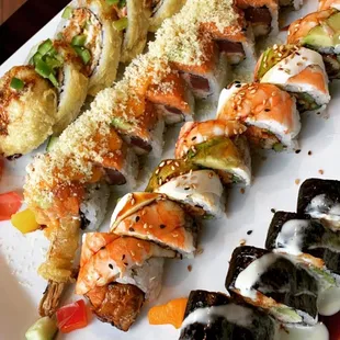 a plate of sushi rolls