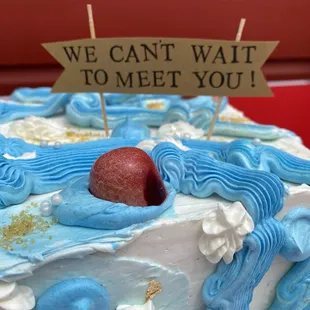 Custom ocean-themed shrikhand cake and sign.