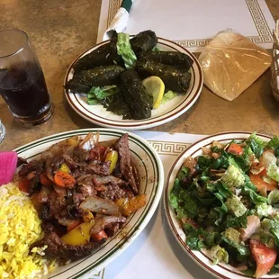 Lamb stuffed grape leaves, lamb gallaba and fatoosh salad.