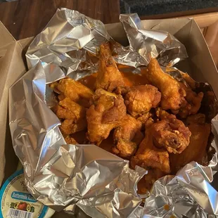 Single order of chicken wings, medium sauce, ranch dressing side, and celery (under the foil)