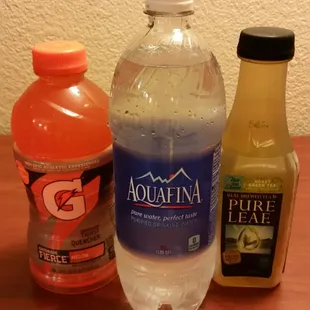 a bottle of aquafina and a bottle of orange juice
