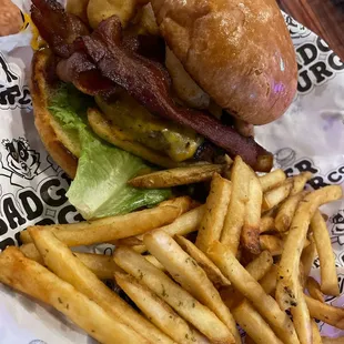 The Wisconsonite Burger.  1/2 lb burger topped with bacon and deep fried cheese curds!  Comes with chive fries.