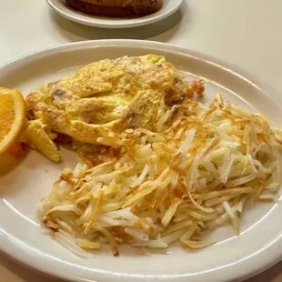 The master omelette with bacon, diced ham, sausage, onion, tomato and mild Ortega chile.