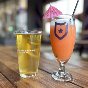 a glass of beer and a pint glass