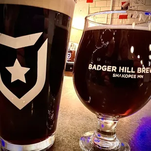 a glass of beer next to a glass of beer