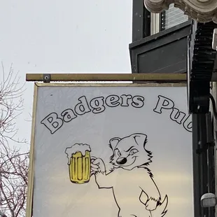 a bear holding a mug of beer