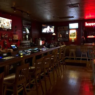 a bar with a lot of chairs