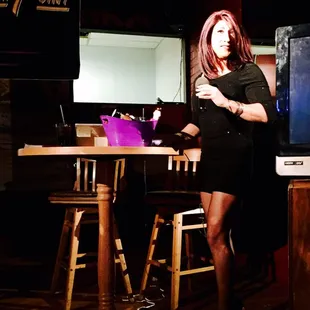 a woman in a black dress