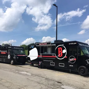 two trucks parked in a parking lot