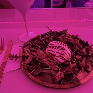 a plate of food and a martini