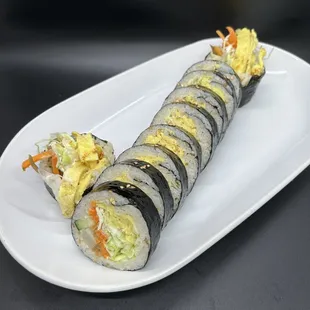 a sushi roll on a white plate