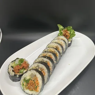 a plate of sushi rolls on a table