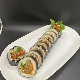 a plate of sushi rolls on a table