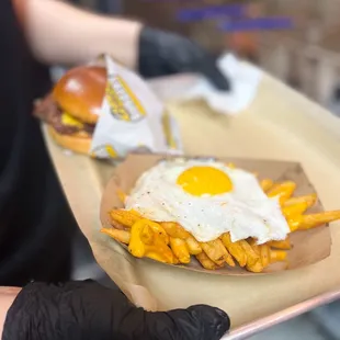 Cheese fries with runny egg