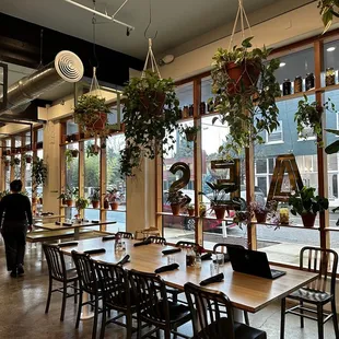 a dining area with tables and chairs