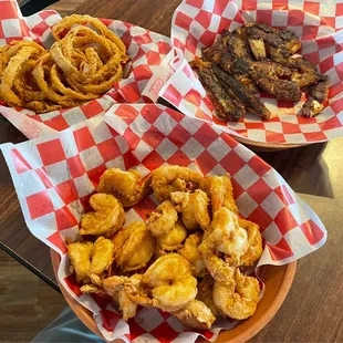 One pound of fried Gulf shrimp, one pound of locally caught blackened drum, and onion rings
