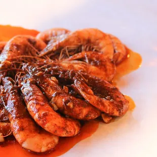 a plate of cooked shrimp