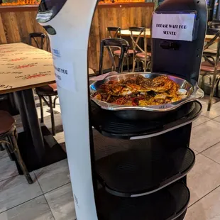 Robot delivering a dish