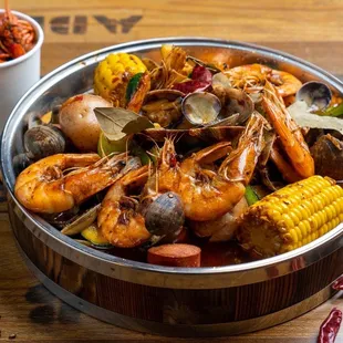  a bowl of seafood and corn