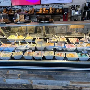 a display case with a variety of pastries