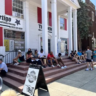 Hanging out on nearby steps at adjoining business eating