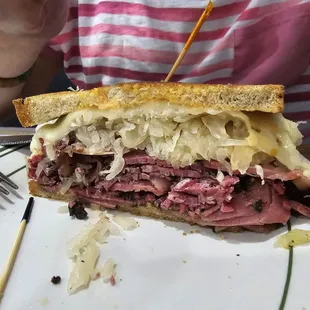 Super Reuben (Regular): corned beef &amp; pastrami, sauerkraut, Swiss, homemade Russian dressing on rye