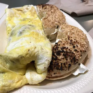 Vegetable omelette and onion bagel with cream cheese.
