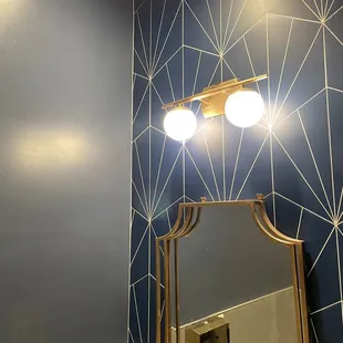 Swanky Art Deco glamorous powder room! Love these modern hexagonal sunburst tiles!