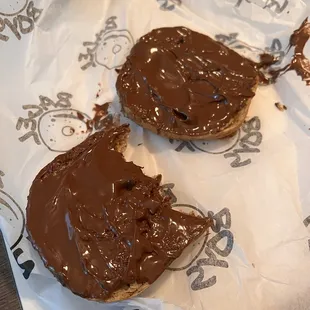 two pieces of chocolate covered bagel