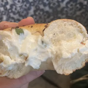 Garlic herb cream cheese on garlic bagel