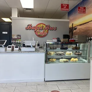 a bakery counter with a variety of pastries