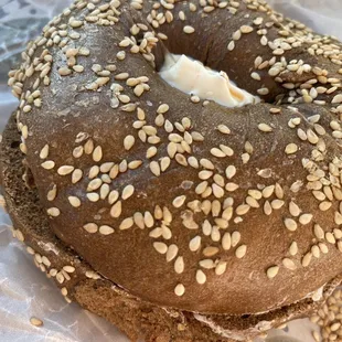 a bagel covered in sesame seeds