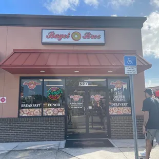 a man walking in front of the store