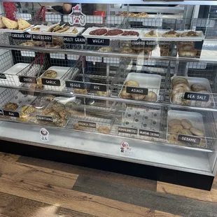 a display case with a variety of baked goods