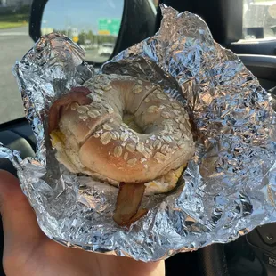 Multigrain bagel,bacon,egg,mayonnaise,salt and pepper