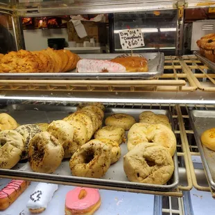 a variety of pastries in a display case