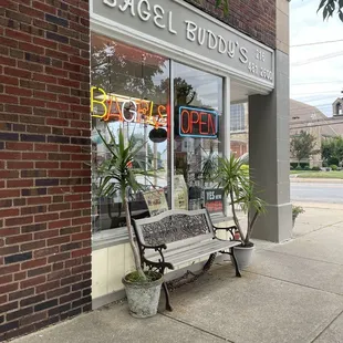 a bench in front of a store