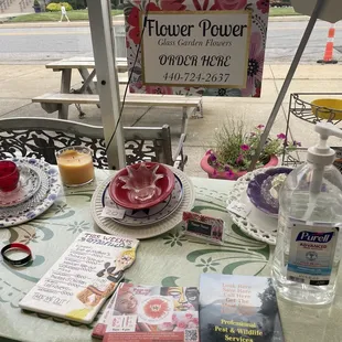 a table with flowers and a sign