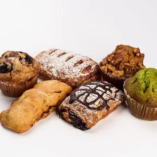 Strawberry cream cheese croissants, chocolate croissants, banana walnut muffin, pistachio muffin, blueberry muffin