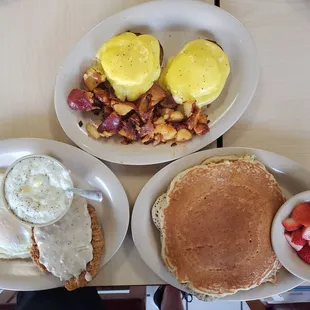 a breakfast of pancakes, eggs, and fruit