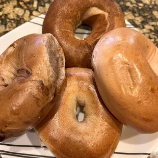 Cinnamon (top), strawberry (right), honey whole wheat (bottom), &amp; cinnamon raisin (left) bagels!